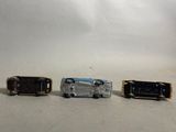three toy cars that are sitting next to each other