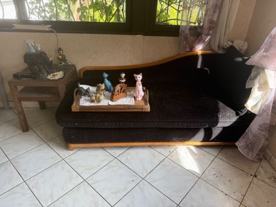 a couch that has a tray on top of it