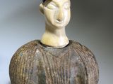 pair of ceramic figurines of a man and a woman
