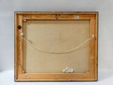 an old picture frame with a rope and a piece of paper in it