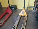 two forklifts sitting next to each other on the floor