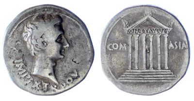 a silver coin with a woman ' s face on it