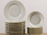 many plates stacked on top of each other on a table