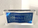 a close up of a one dollar bill on a table