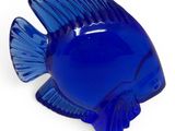 an image of a blue glass fish on a white background