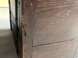 a close up of a piece of wood with a handle on it