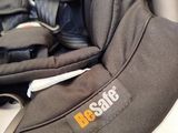 a baby car seat with a seat belt attached to it