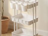 an image of a kitchen cart with pots on it