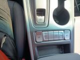 a close up of a car ' s dashboard with a remote control