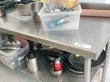 many pots and pans sitting on the kitchen counter