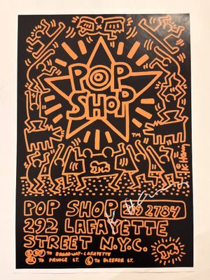 an orange and black poster with a design on it