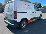 the van is parked in the parking lot near the curb