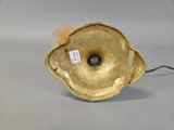 an image of a gold plate lamp with a cord attached to it