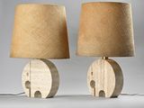 pair of wooden table lamps with burlock lampshads on top of them