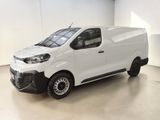 a white van is parked in a large room