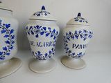 three blue and white vases sitting next to each other on a table