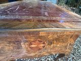a wooden table that has a design on it