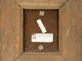 a picture of a piece of wood with a tag on it