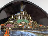 a decorative plate with a picture of a castle on it