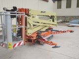 a picture of a scissor is parked outside of a building
