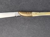 a knife that is laying on a table