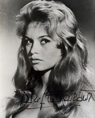 an old black and white photo of a woman with long hair
