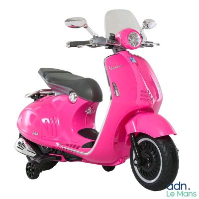 a pink scooter that is parked on a white surface