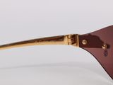 a close up of a pair of sunglasses on a white surface