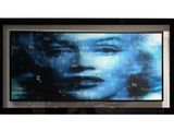 a picture of a picture of a woman on a television screen