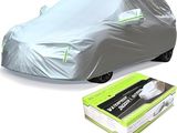 the car is covered with a silver cover and a box of tissues