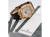 an image of a watch sitting on top of a stack of books