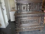 a very old wooden chest in the middle of a room