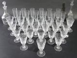 a lot of wine glasses sitting on a table