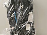 a plastic bag with a pair of scissors inside of it