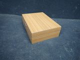 an image of a small wooden box on a blue surface