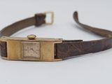 an image of a wrist watch with a brown leather strap