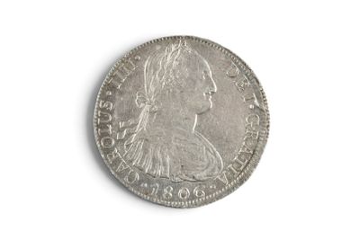a close up of a coin on a white surface with a white background