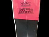 a picture of a pink and black box with a sticker on it