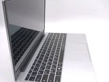 a close up of a laptop computer on a white surface