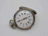a silver pocket watch with roman numerals on it
