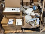 a pile of boxes and boxes on a pallet in a warehouse