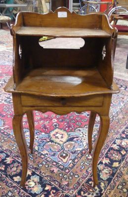 a small wooden table with a drawer on top of it