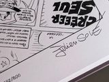 a drawing of a comic strip on a table