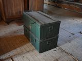 a green box sitting on the floor in a room