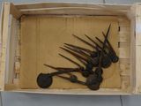 a wooden box with a bunch of scissors inside of it