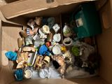 a cardboard box filled with many different types of toys