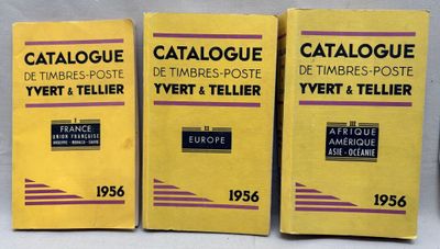 three boxes of catalogues on a table with a white background