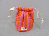an orange and pink bag with a white ribbon on it