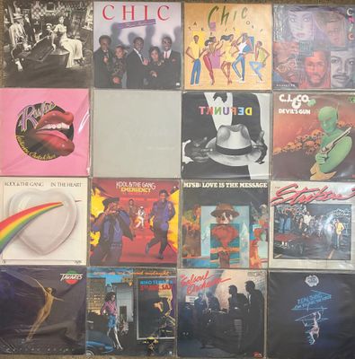 a lot of different album covers on the wall