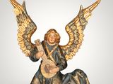 an image of a figurine of an angel playing a guitar